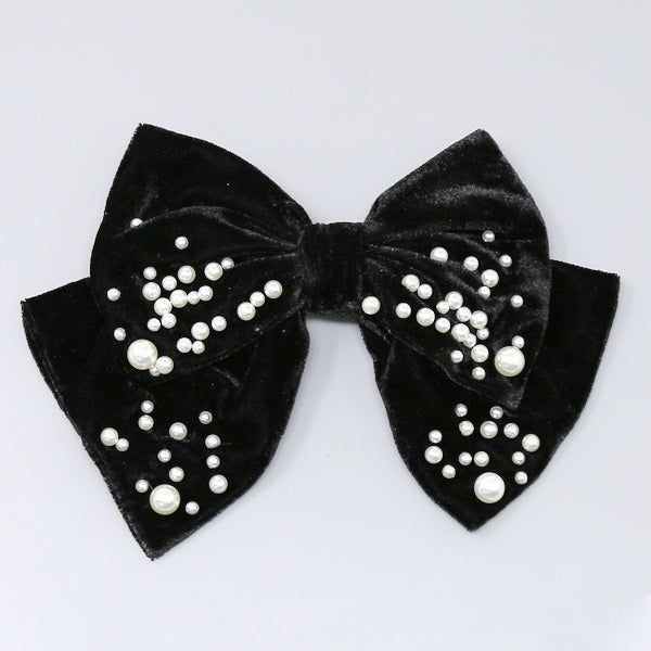 Velvet and pearl hair bow